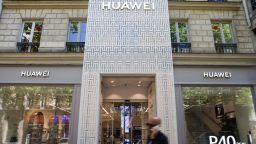 A pedestrian passes the Huawei Technologies Co. flagship store in Paris, France, on Tuesday, July 7, 2020. France's decision to give only temporary security approval for 5G mobile equipment shows the government intends to gradually sideline Huawei, a majority party lawmaker said. Photographer: Nathan Laine/Bloomberg via Getty Images