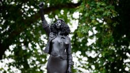 BRISTOL, ENGLAND - JULY 15: A new sculpture, by local artist Marc Quinn, of Black Lives Matter protestor Jen Reid stands on the plinth where the Edward Colston statue used to stand on July 15, 2020 in Bristol, England. A statue of slave trader Edward Colston was pulled down and thrown into Bristol Harbour during Black Lives Matter protests sparked by the death of an African American man, George Floyd, while in the custody of Minneapolis police in the United States of America. The Mayor of Bristol has since announced the setting up of a commission of historians and academics to reassess Bristol's landmarks and buildings that feature the name of Colston and others who made fortunes in trades linked to slavery. (Photo by Matthew Horwood/Getty Images)