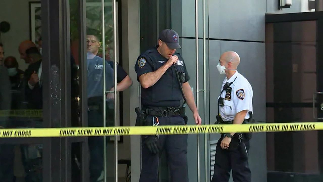 Police are seen outside the building in Manhattan's Lower East Side.