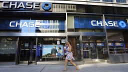 A pedestrian walks past a JPMorgan Chase & Co. bank branch in New York, U.S., on Thursday, July 9, 2020. JPMorgan Chase is scheduled to release earnings figures on July 14. Photographer: Peter Foley/Bloomberg via Getty Images