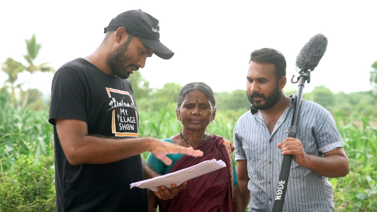 Gangavva Milkuri (center) with producer Srikanth Sriram (left) and actor Raj Kadire (right) filming for their YouTube channel My Village Show. 