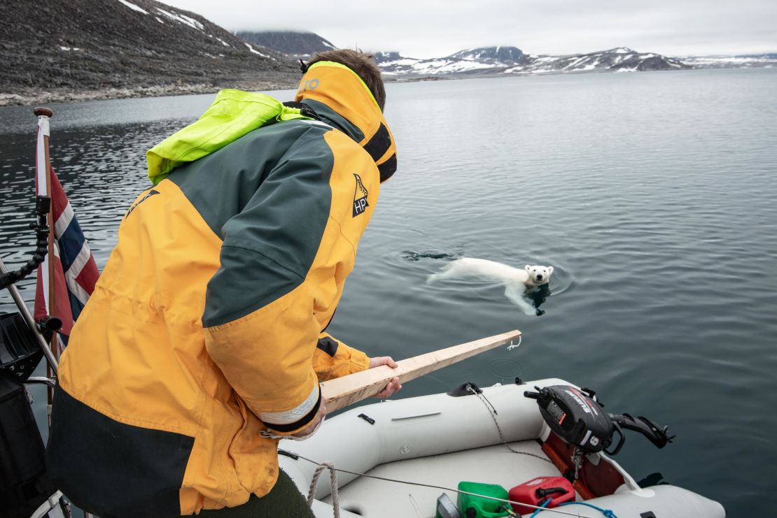 A wooden pole used to shove away ice came in handy during the crew's first up-close polar bear encounter.