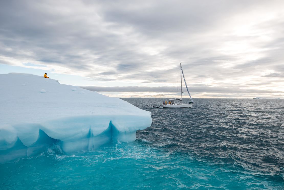 Ivan Kutasov sits atop an iceberg floating off Nordaustlandet, Svalbard's second-largest island.