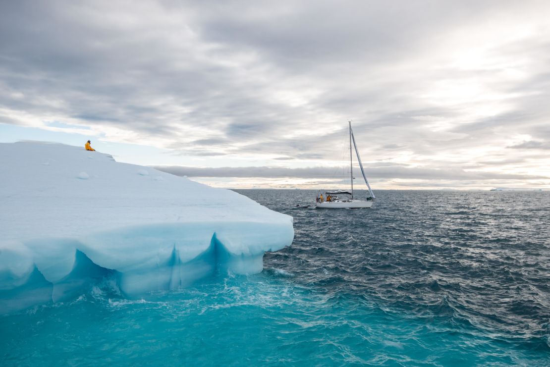 Ivan Kutasov sits atop an iceberg floating off  Nordaustlandet, Svalbard's second-largest island.