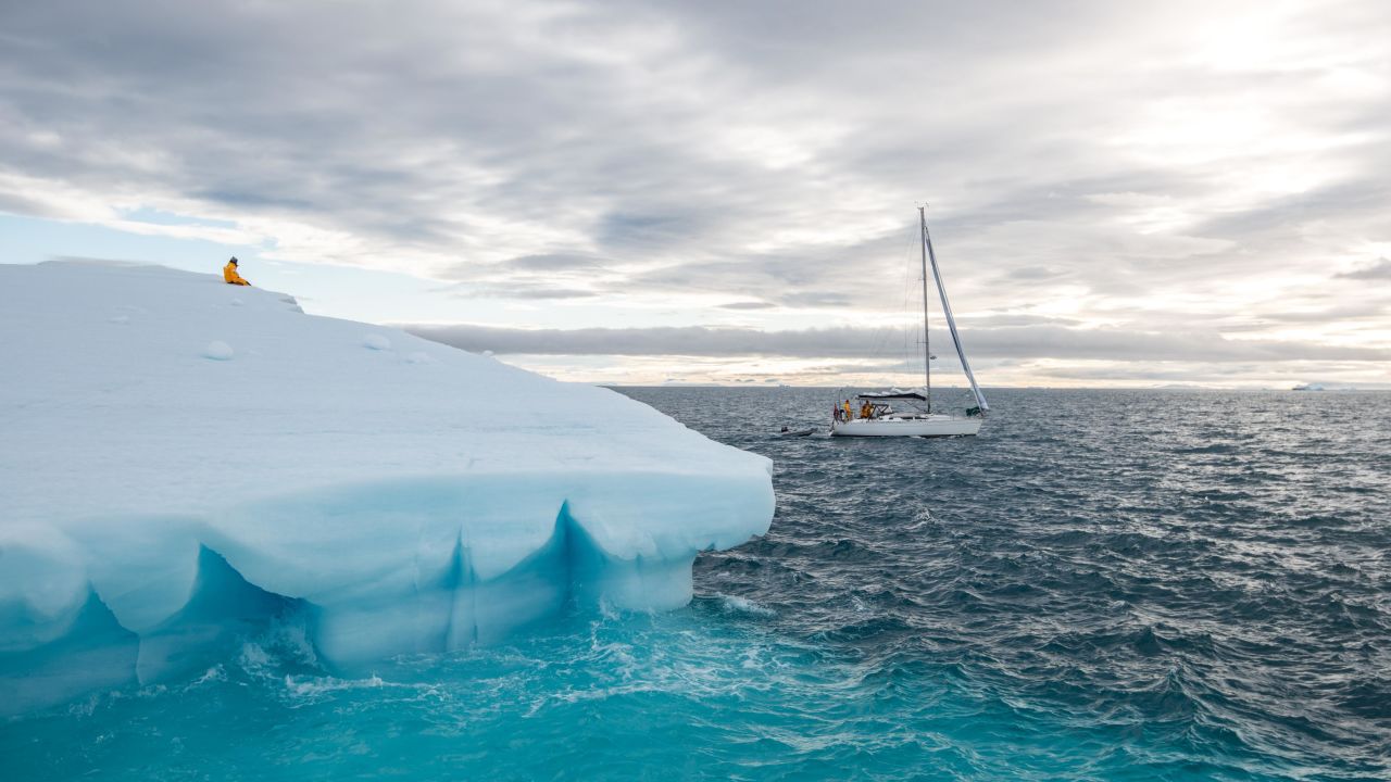 Ivan Kutasov sits atop an iceberg floating off  Nordaustlandet, Svalbard's second-largest island.