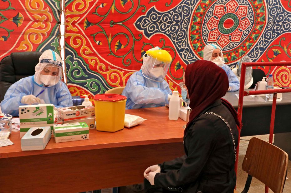 Doctors from the Palestinian Ministry of Health take blood samples in Hebron, West Bank, on July 15.