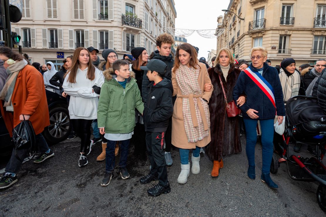 Cedric Chouviat's widow Doria and her children take part in a march in Levallois, near Paris, on January 12, 2020.