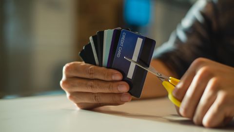 underscored cancel credit card cutting cards in half