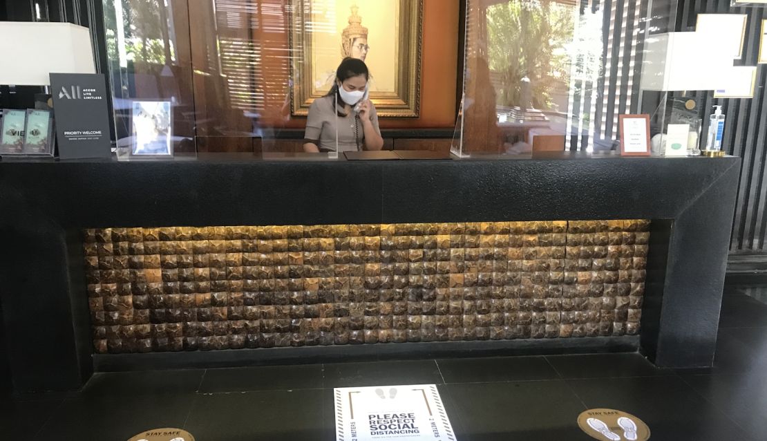 At Hua Hin's V Villas, floor markers remind guests to practice social distancing at the check-in counter.