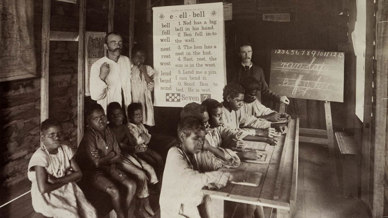 Indigenous children are seen at a Church of England mission school in Yarrabah, north Queensland, in 1893. Indigenous students were often forced to learn English and forbidden from speaking their own languages. 