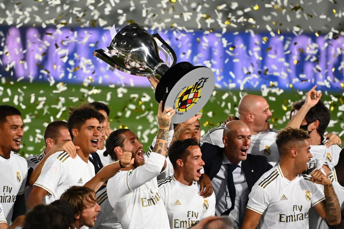 Real Madrid captain Sergio Ramos holds aloft La Liga trophy.