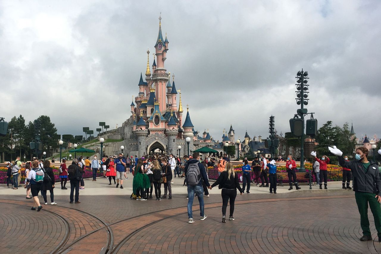 Visitors walk through Disneyland Paris after <a href="https://www.cnn.com/travel/article/disneyland-paris-reopens/index.html" target="_blank">its reopening</a> on Wednesday, July 15.