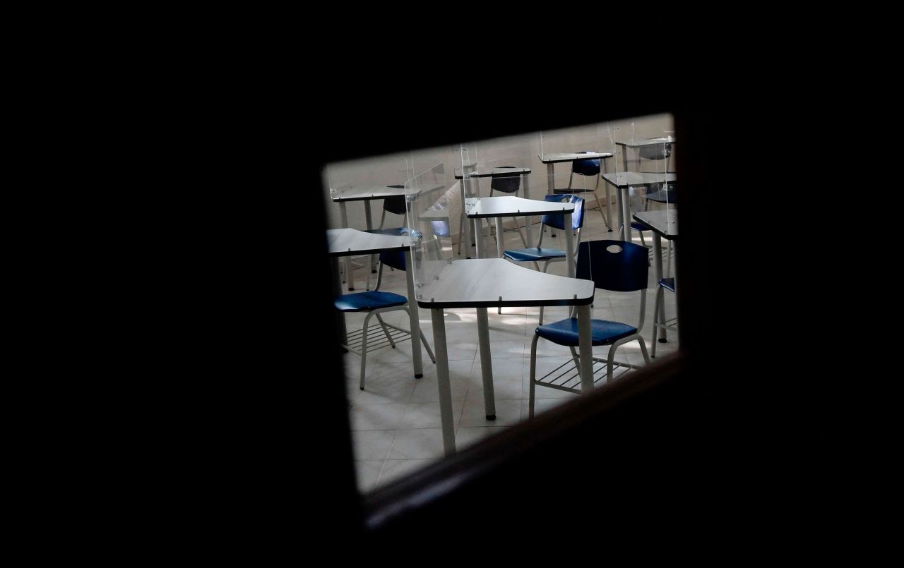 Acrylic shields, aimed at preventing the spread of the novel coronavirus, are seen on desks inside a Mexico City classroom on Wednesday, July 15.