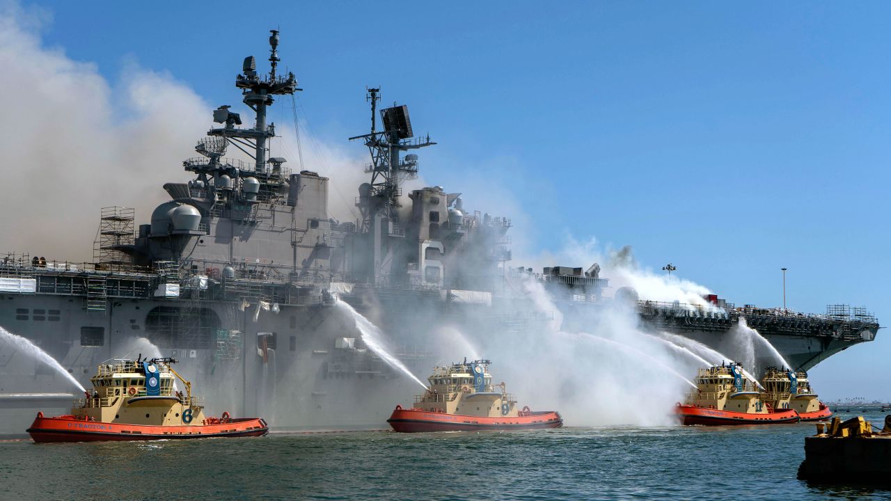 Sailors and federal firefighters try to extinguish a blaze on the USS Bonhomme Richard, <a href="https://www.cnn.com/2020/07/14/us/bonhomme-richard-fire-tuesday/index.html" target="_blank">which caught fire</a> at Naval Base San Diego on Sunday, July 12.