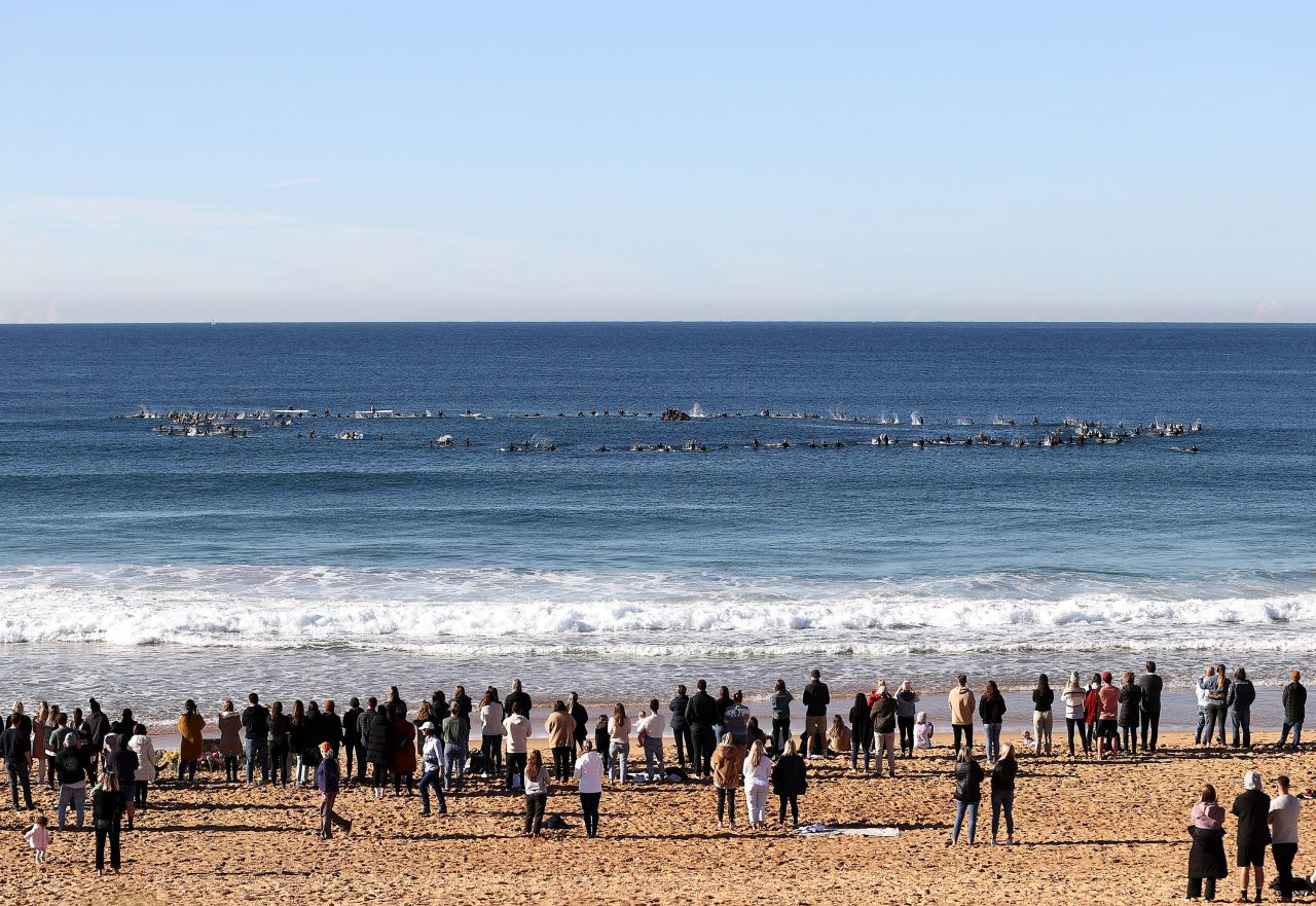 Surfers form a ring at Sydney's North Narrabean Beach to pay tribute to Alex "Chumpy" Pullin on Sunday, July 12. Pullin, a two-time world champion snowboarder, <a href="https://www.cnn.com/2020/07/08/sport/alex-pullin-australia-death-scli-spt-intl/index.html" target="_blank">recently died while spearfishing in his native Australia.</a>