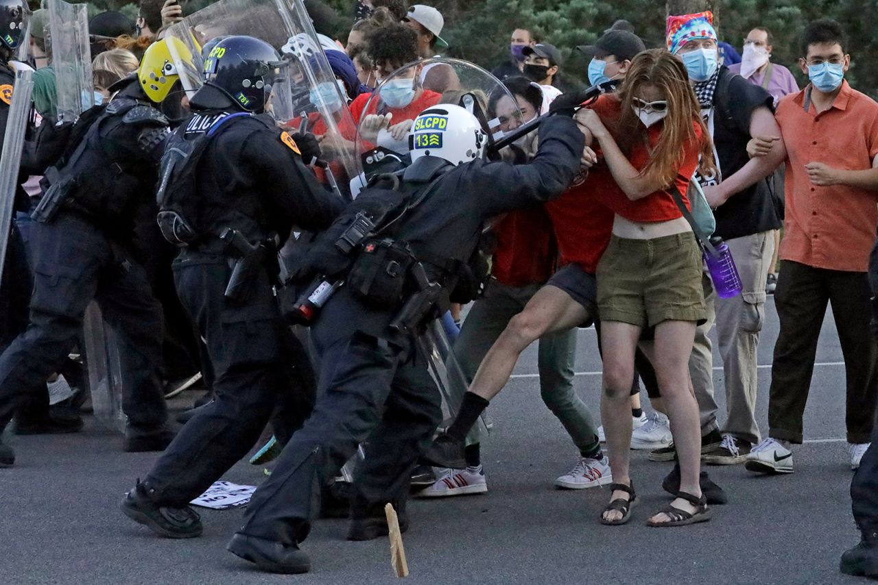 Protesters clash with police officers near the district attorney's office in Salt Lake City on Thursday, July 9. <a href="https://www.cnn.com/2020/07/10/us/utah-state-of-emergency-protests-shooting/index.html" target="_blank">The protests began</a> hours after the district attorney announced that the fatal police shooting of Bernardo Palacios-Carbajal was justified.