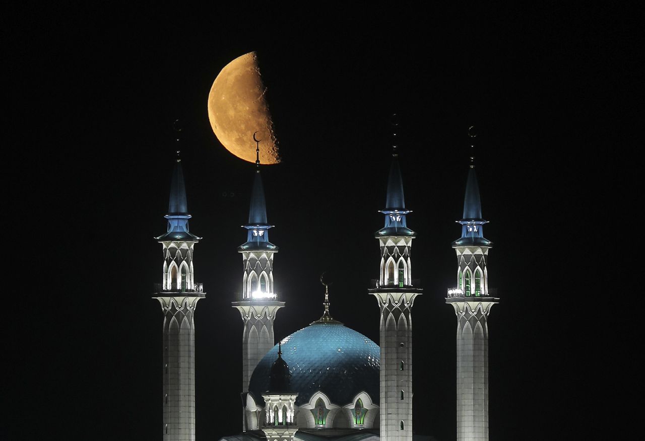 The moon is seen over the Kul Sharif Mosque in Kazan, Russia, on Sunday, July 12.