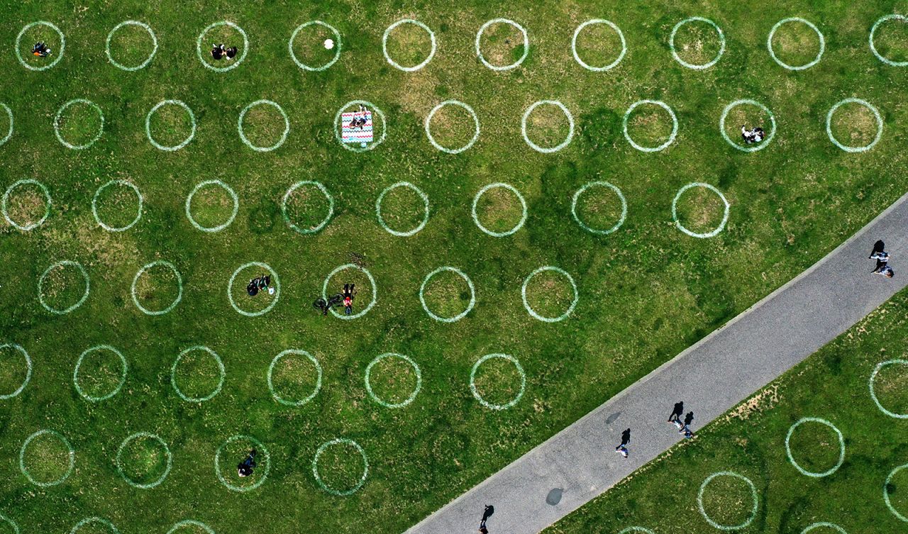 Social-distancing circles are seen at the Rhine promenade in Düsseldorf, Germany, on Sunday, July 12.