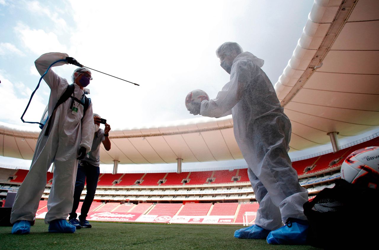 Soccer balls are sanitized before a preseason tournament in Guadalajara, Mexico, on Sunday, July 12. The pro tournament is being played without spectators.