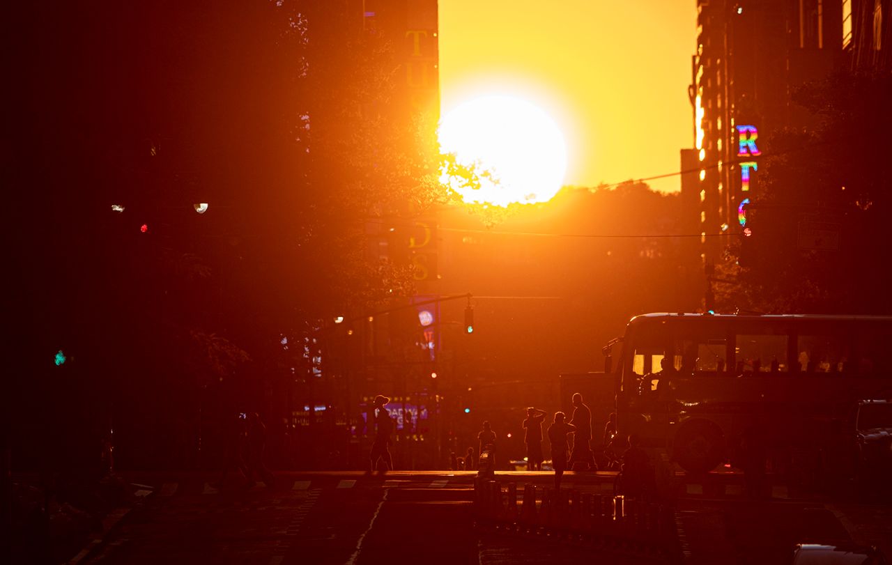 The sun sets along 42nd Street during the "Manhattanhenge" phenomenon on Monday, July 13. Manhattanhenge happens just a few times each year, when the sun rises or sets parallel to the city street grid in New York's Manhattan borough. <a href="http://www.cnn.com/2020/07/09/world/gallery/week-in-photos-0710/index.html" target="_blank">See last week in 25 photos</a>