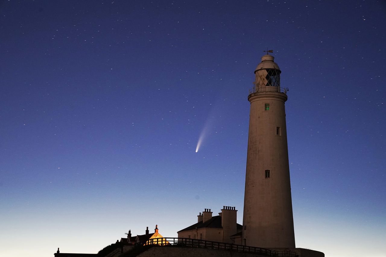 <a href="https://www.cnn.com/2020/07/13/world/comet-neowise-pictures-how-to-see-scn-trnd/index.html" target="_blank">The comet NEOWISE</a> passes St. Mary's Lighthouse in Whitley Bay, on the northeast coast of England, early on Tuesday, July 14. It's extremely rare for comets to be visible to the naked eye. Being able to catch a glimpse of this one is a once-in-a-lifetime opportunity, as it won't pass Earth again for another 6,800 years, according to the International Dark-Sky Association.