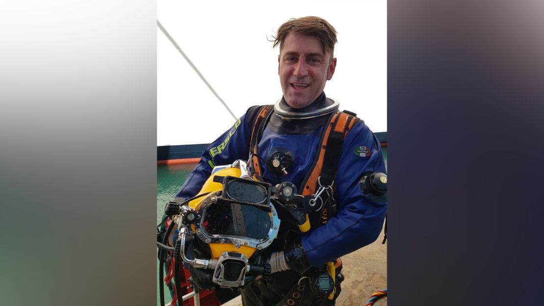 Diver Emiliano Pescarolo is pictured in the Port of Civitavecchia, Italy, in November 2019.