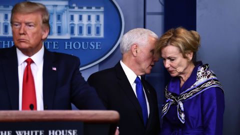 Dr. Birx listens to Vice President Mike Pence, during a briefing at the White House on March 18.
