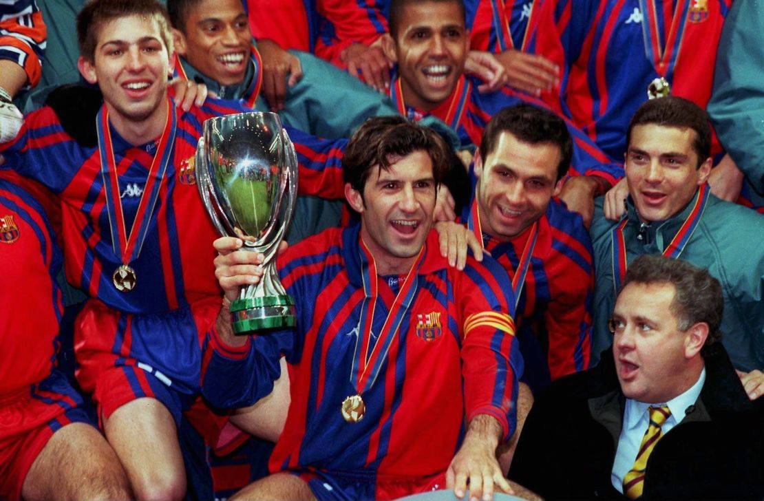 Figo celebrates winning the Super Cup with Barcelona in 1998. 