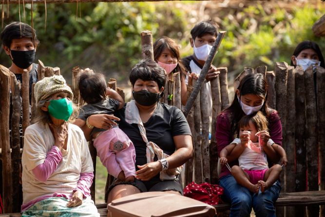 Members of the Guarani Mimbya indigenous community wait to be tested in Cananeia, Brazil, on July 10.