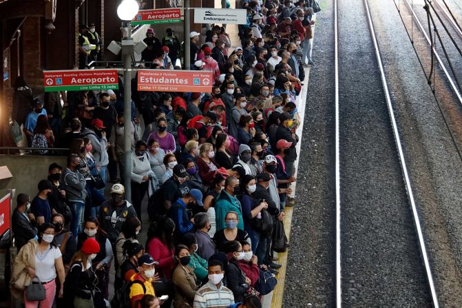 Passengers wait on a crowded train platform in Sao Paulo on Monday, July 13.