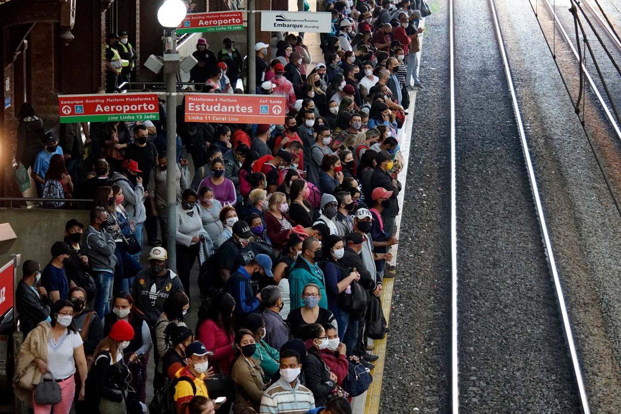 Passengers wait on a crowded train platform in Sao Paulo on Monday, July 13.
