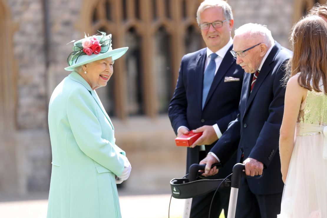 The Queen talks with Moore and his family.