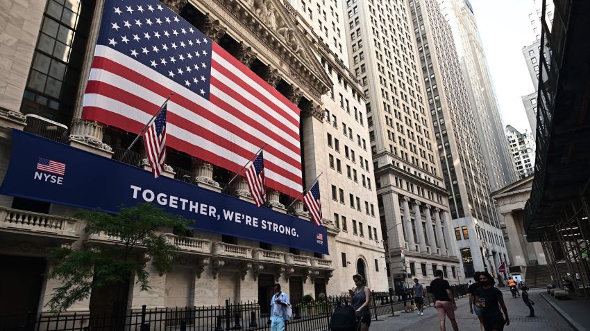 People walk outside the New York Stock Exchange (NYSE) on July 13, 2020 at Wall Street in New York City. - The Nasdaq tumbled July 13, 2020, ending a three-session streak of records on a weak day for US stocks amid fresh restrictions in California to address the coronavirus. (Photo by Johannes EISELE / AFP) (Photo by JOHANNES EISELE/AFP via Getty Images)