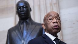 Rep. John Lewis, D-Ga., the civil rights leader stands beneath a bust of Rev. Martin Luther King Jr., as members of the Congressional Black Caucus gather for the memorial ceremony for the late Maryland Rep. Elijah Cummings, at the Capitol in Washington, Thursday, Oct. 24, 2019. Rep. Cummings, a Democrat and chairman of the House Oversight and Reform Committee, died Oct. 17 after complications from long-standing health problems. (AP Photo/J. Scott Applewhite)