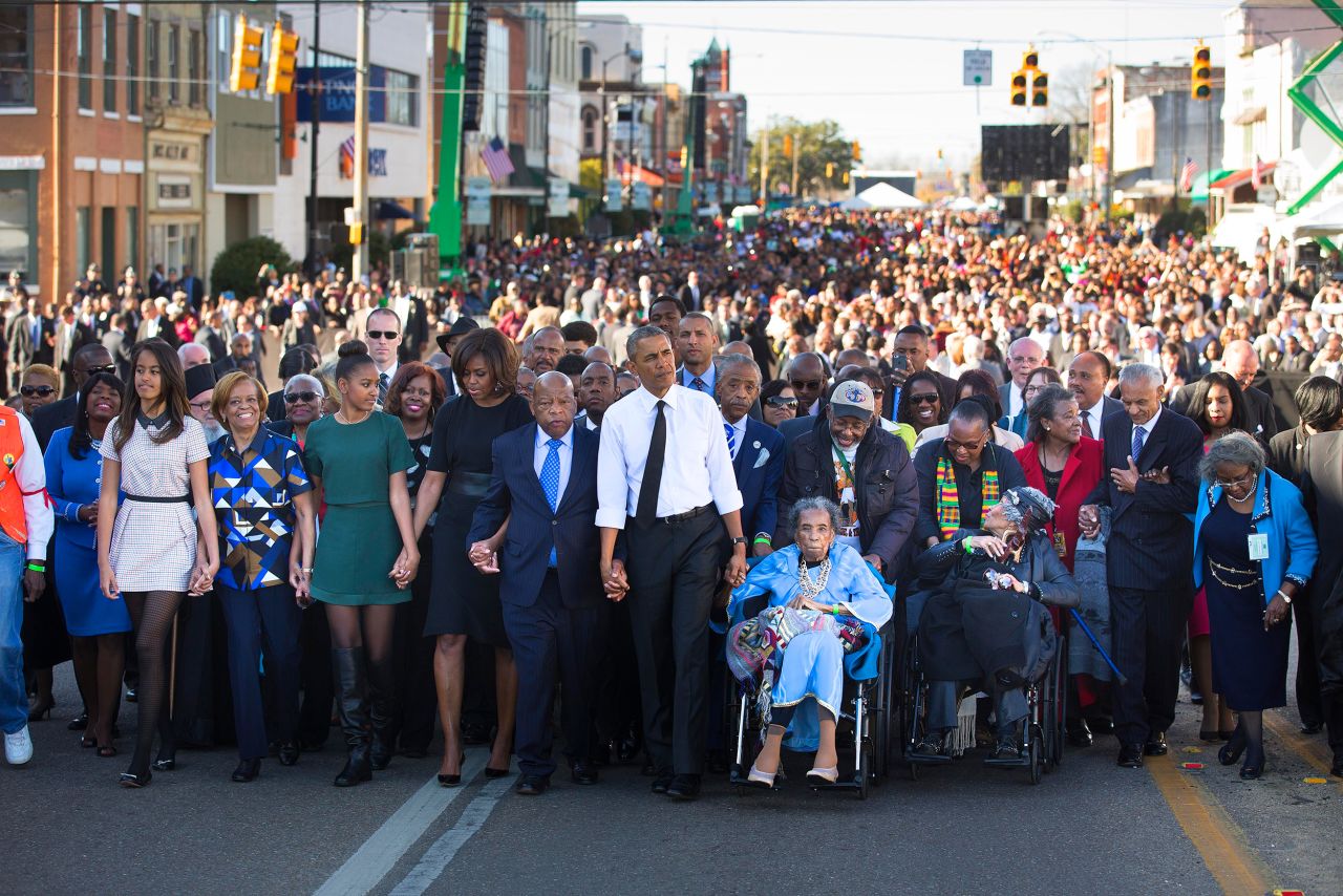 Lewis joins President Obama and his family on a march toward Selma's Edmund Pettus Bridge on the 50th anniversary of "Bloody Sunday."
