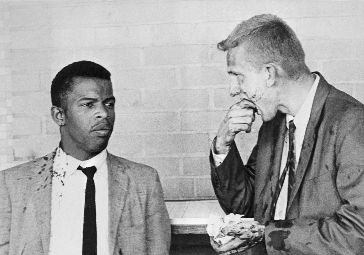 Lewis and James Zwerg, another Freedom Rider, stand together after being attacked by segregationists in Montgomery.