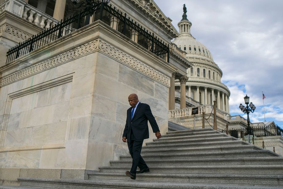 Lewis walks down the steps of the US Capitol in January 2017.