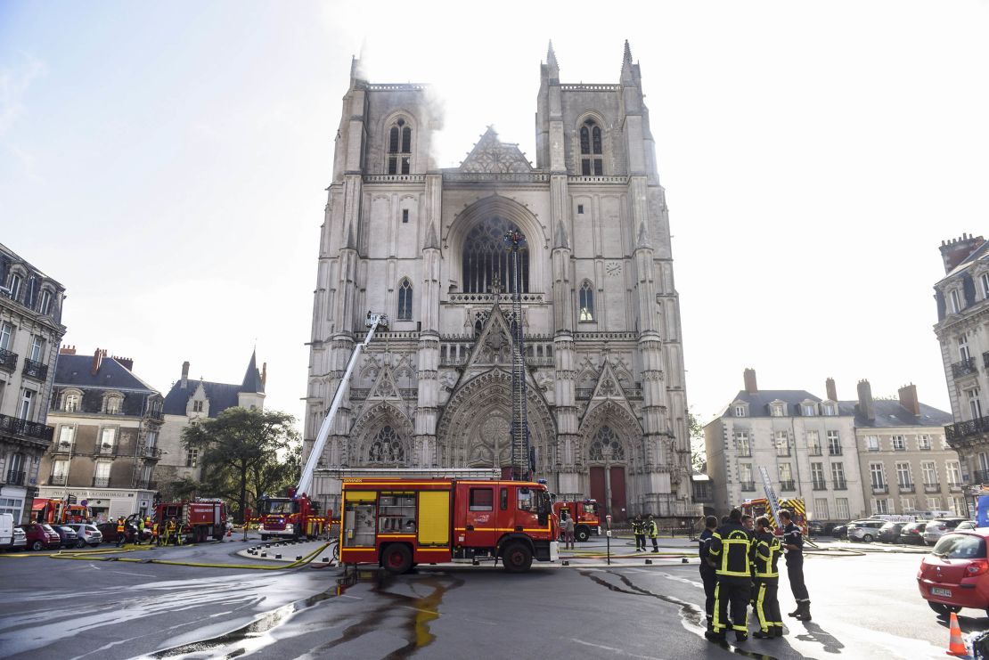 Firefighters work to put out a fire at the Saint-Pierre-et-Saint-Paul cathedral in Nantes.