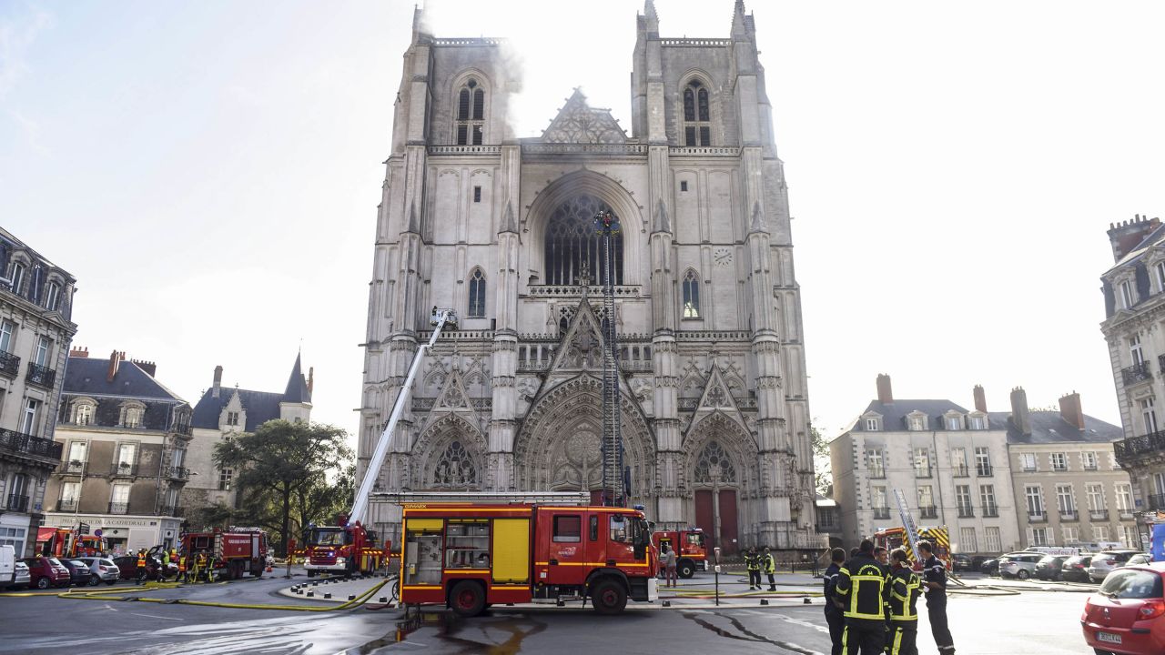 Firefighters work to put out a fire at the Saint-Pierre-et-Saint-Paul cathedral in Nantes.