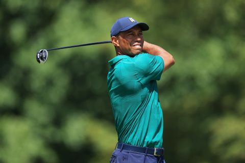 Competitive return: Fast forward to July and after struggling to make the cut and troubled by persistent back problems at the Memorial tournament at Muirfield Village Golf Club in Dublin, Ohio, Tiger Woods showed promise of better things to come with a battling one-under-par 71 in the third round, though he then hit a 76 in the tournament's final round.