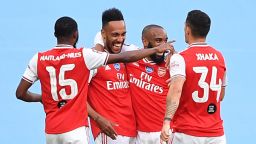 Arsenal's Gabonese striker Pierre-Emerick Aubameyang (second left) is surrounded by teammates after scoring the opening goal of the FA Cup semifinal against Manchester City at Wembley. 