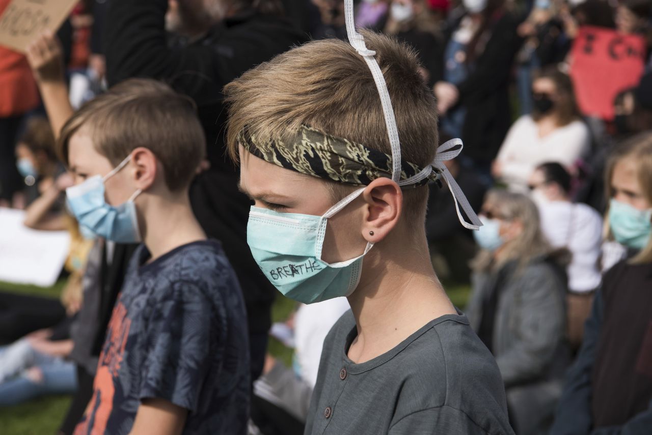 <strong>Australia:</strong> Kids wear face masks  at Adelaide's Victoria Square demonstrate in support of the Black Lives Matter movement and against Aboriginal Australian deaths in custody. 