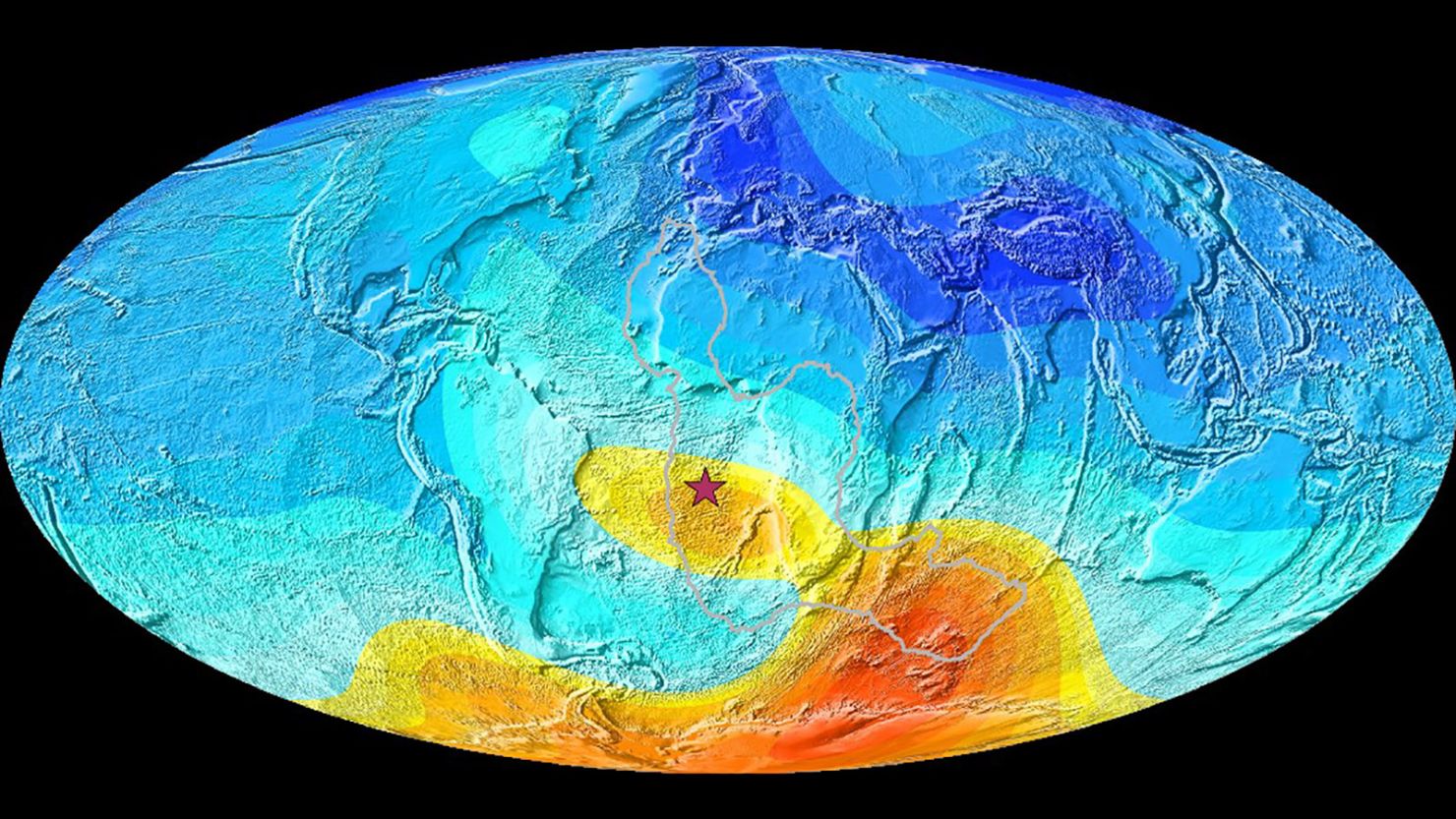 A map of the Earth showing the present-day deviation from expected magnetic field direction. Strong deviations are in yellow-orange, and little deviations are in blue. The star is Saint Helena, which is right in the anomaly. The gray line shows the outline of the seismic area that is warmer than the rest of the mantle.