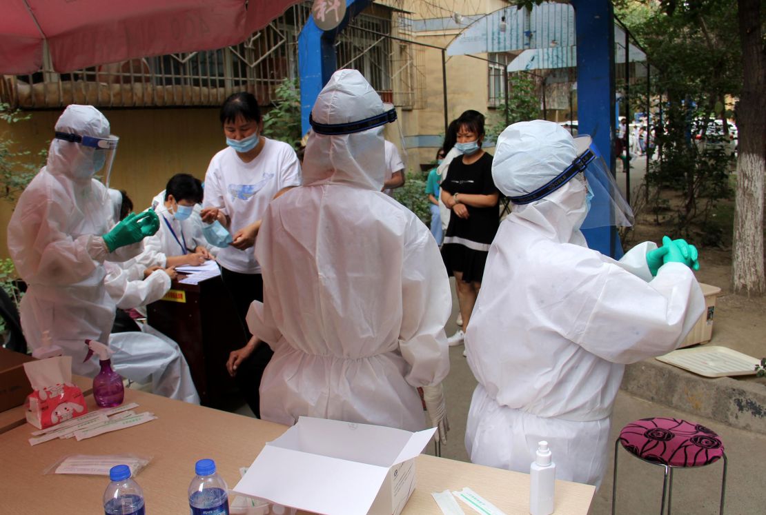 Residents undergo testing for the coronavirus on July 19 in Urumqi, China.
