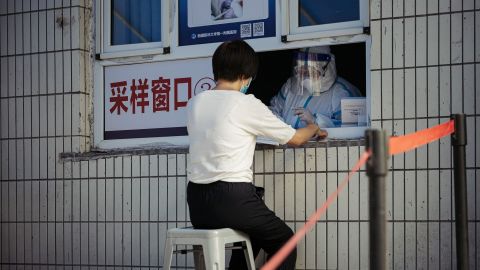 A woman receives a Covid-19 nucleic acid test at the First Affiliated Hospital of Xinjiang Medical University on June 25 in Urumqi, China.