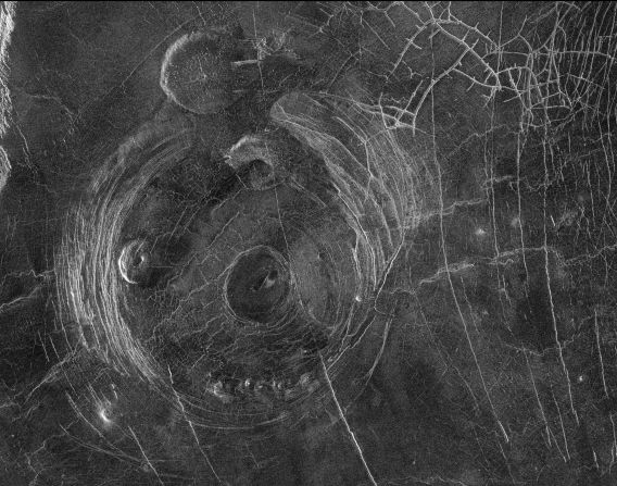 This radar image captured by NASA's Magellan mission to Venus in 1991 shows a corona, a large circular structure 120 miles in diameter, named Aine Corona. 