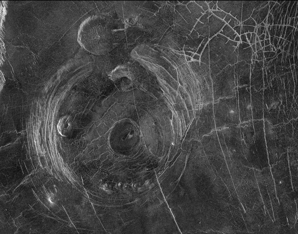 This radar image captured by NASA's Magellan mission to Venus in 1991 shows a corona, a large circular structure 120 miles in diameter, named Aine Corona. 