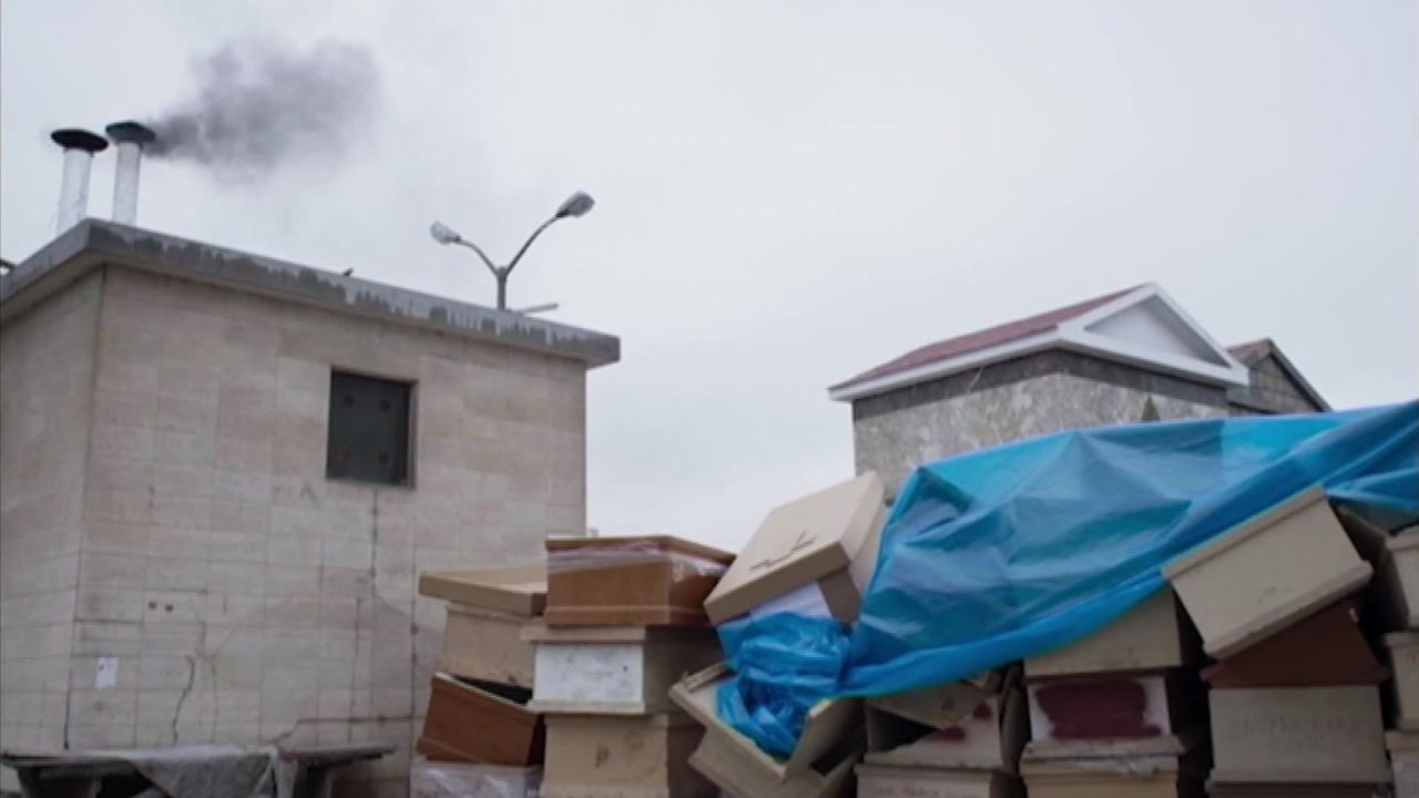 A stack of cardboard coffins beside the cremetorium.