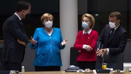 Netherlands' Prime Minister Mark Rutte (L) talks with Germany's Chancellor Angela Merkel ( 2nd L), President of the European Commission Ursula von der Leyen (2nd R) and France's President Emmanuel Macron prior the start of the European Council building in Brussels, on July 18, 2020, as the leaders of the European Union hold their first face-to-face summit over a post-virus economic rescue plan. - The EU has been plunged into a historic economic crunch by the coronavirus crisis, and EU officials have drawn up plans for a huge stimulus package to lead their countries out of lockdown. (Photo by Francisco Seco / POOL / AFP) (Photo by FRANCISCO SECO/POOL/AFP via Getty Images)