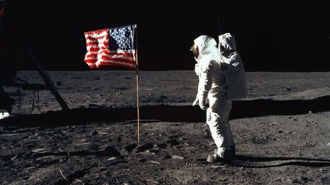 Edwin "Buzz" Aldrin poses for a photograph beside the United States flag on the lunar surface.